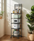 Five Tier Heavy Duty Storage Rack With Smooth Swivel Rolling Wheels Industrial Platform Shelving Unit For Garage Home Organization Rock Solid Rust Coated Steel Frame, filled with bowls and cookers.