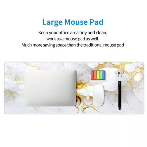 Top view of Boss Size Desk Pad For Gaming And Work 31.5 By 11.8 Inches Waterproof Thick Desk Mat with laptop and accessories