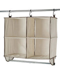 Total Closet Game Changer Hanging Purse Organizer For Wardrobe Dustproof Handbag Storage Rack with four compartments.