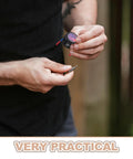 Person holding a small aerosol can with wires for the Top Shelf Automatic Aerosol Fire Extinguisher for car engine use.