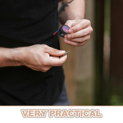 Person holding a small aerosol can with wires for the Top Shelf Automatic Aerosol Fire Extinguisher for car engine use.