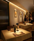 Restaurant setting with a cordless table lamp with 6000mAh battery IP54 waterproof all aluminum body touch dimming warm light on table