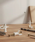 50 Pack Drywall Toggle Anchors With Screws For Hollow Walls, shown with expanded nylon anchors and screws on wooden surface