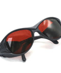 Badass OD4 Plus Laser Safety Goggles Offering Rock Solid Eye Shield From UV Through Near Infrared Bands Designed For Heavy Duty Lab Work And Precision Manufacturing Delivering Top Tier Rad Protection For Pros Who Crave Zero Compromise Performance, black frame, red lenses.