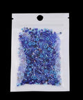 Top Shelf 800 Piece Assorted Black Glass Seed Beads With Multi Shape Spacer Mix Designed For Hustle Free Handmade Jewelry Crafting Creative Kits Wedding Accents And Prime Fashion Upgrades in a clear bag with assorted blue beads.