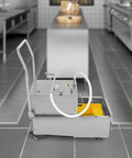 Heavy Duty Commercial Fryer Oil Filter Cart, 550 Watt Stainless Steel Machine Pumping 8.5 Gals Per Minute in a kitchen.