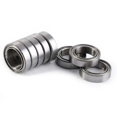 Smooth As Butter 10Pcs 10X15X4MM Double Shielded 6700ZZ Thin Bearings displayed in a stack and scattered, made of steel.