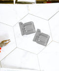 Heavy Duty Stainless Steel Solar Panel Mounting Clips 3 Pack Tough As Nails Roof Brackets clamp hardware on a tile surface.