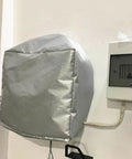 Badass Outdoors EV Charger Shelter With Top Shelf Weather Shield covers an EV charger mounted on a wall.