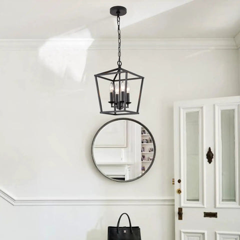 Go-To Industrial Black Four-Light Pendant With Candle-Style Cage Chandelier hanging in a bright entryway.