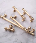 10 Pack Brushed Brass Cabinet Pulls Featuring Seven Point Five Inch Center To Center Spacing Slick Zinc Alloy Kitchen Drawer Handles Top Shelf Smooth Finish No Hassle Install Hardware For Fresh Home Renovation Projects on marble background.