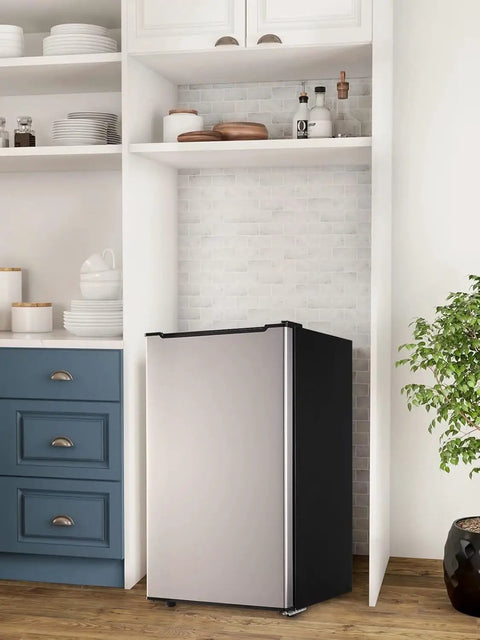 Sleek 3.2 Cu Ft Upright Mini Freezer With Adjustable Removable Shelves And Dope Silver Cabinet in a modern kitchen setting.