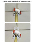 Close-up of extendable smoke detector removal rod with hook attached to ceiling, showcasing heavy-duty aluminum shaft.