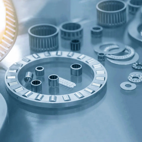 Tough As Nails One Way Clutch Needle Roller Bearings HF1216 showing chrome steel rollers and components on a surface.