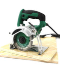 Badass 4 Inch Electric Circular Saw With Killer 1400W Motor For Marble Wood And Stone Slotting Portable Cutter on cutting board.