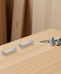 M6 Binding Screws 100 Piece Set Cold Rolled Steel Furniture Connectors on a wooden surface with additional screws for assembly.