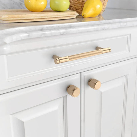 Top Shelf 10 Pack 5 Inch Gold Knurled Cabinet Pulls With 128mm Mounting Holes, Fresh Gold Finished Drawer Pulls on white kitchen cabinetry.