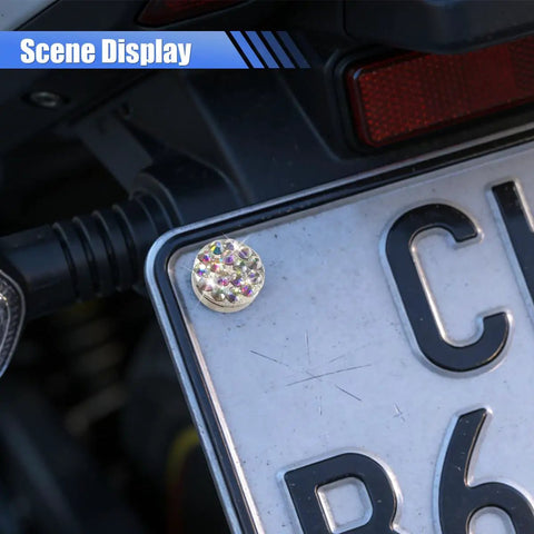 Sparkly rhinestone bolt from the Fly Bling Rhinestone License Plate Screw Kit on a vehicle license plate.
