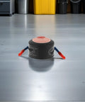 Vanzack Tiny Auto Fire Extinguisher For Car Engine And Garage Use Lightweight Alum Alloy Compact Emergency Safety Sprayer viewed from above on floor.