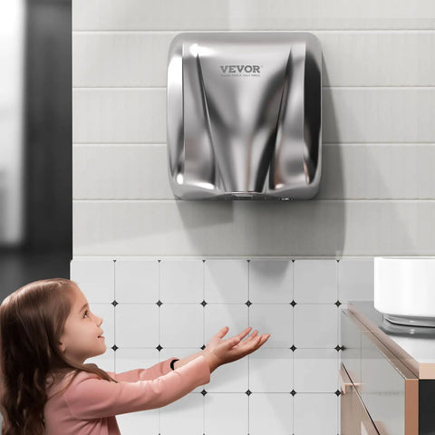 Heavy Duty Commercial Hand Dryer 1300W Automatic High Speed Stainless Steel Warm Wind Wall Mounted in use by young girl in restroom