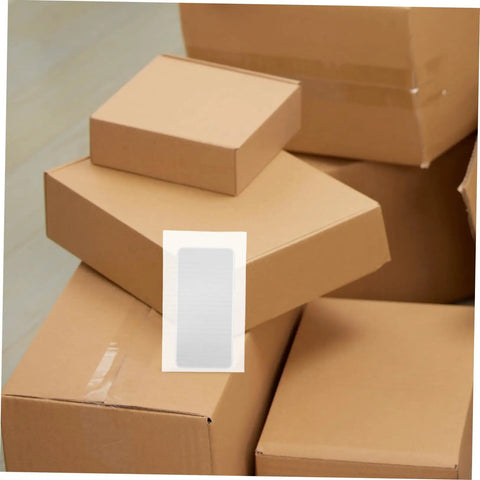 Premium Foam Packing Sheets For Shipping And Storage 100 Pack Heavy Duty Cushioning Pads nestled among brown shipping boxes.