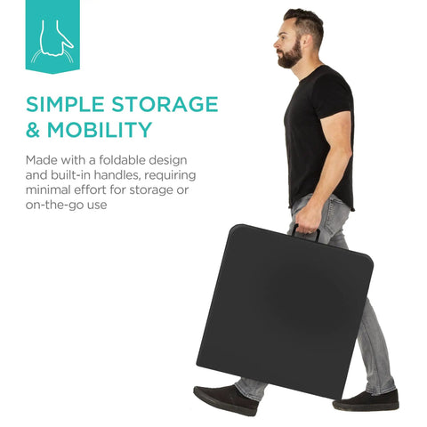 Man carrying a black Four Foot Plastic Folding Table Heavy Duty Portable With Carry Handle Ideal For Indoor Outdoor Use