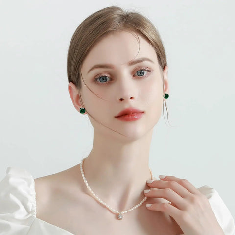Top Tier Titanium Screw Back Stud Earrings For Women And Men Featuring Hypoallergenic Surgical Steel shown with a pearl necklace.