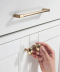 10 Pack Classic Solid Cabinet Handles Set 6.3 Inch Screw Spacing in Champagne Bronze installed on white cabinet