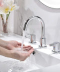 Person washing hands using Chrome Finish Widespread Bathroom Sink Faucet With 8 Inch Spread For 3 Hole Vanities