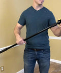 Person holding Popcorn Ceiling Scraper Vacuum Attachment for Shop Vacuums, showing tool handle and scraper head.