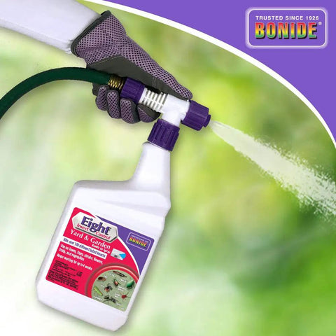 Eight Insect Control Yard And Garden Ready To Spray 32 oz bottle being used on lawn with hose attached