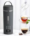 Gray Travel Electric Kettle With 6 Temperature Presets, LCD Display, 304 Stainless Steel, 450ml Capacity, Auto Shutoff And Boil Dry Protection shown with tea and coffee cups
