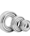 Top Shelf Stainless Steel Deep Groove Ball Bearing High Speed Precision S6315 Sealed Radial Type three sizes on white background.