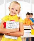 Child holding Two Pack Dry Erase Math Boards For Multiplication And Division With Charts, Kid Friendly Whiteboards, Classroom Setting