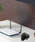Rock Solid Under Desk Laptop Mount With Heavy Duty Black Bracket For Secure Storage And No Fuss Setup To Keep Your Workspace Neat And Super Functional All Week, featuring a router and black brackets.