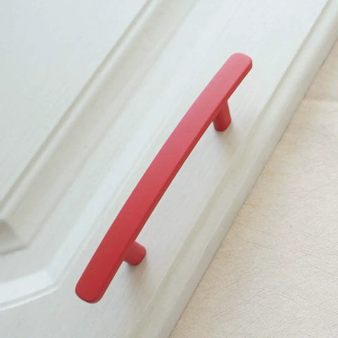 Top Shelf Red Drawer Pulls For Kitchen Cabinets And Dressers Rock Solid Zinc Alloy Construction 3 Inch Hole Spacing Quick Install Durable Modern Furniture Hardware Kit on white drawer front.