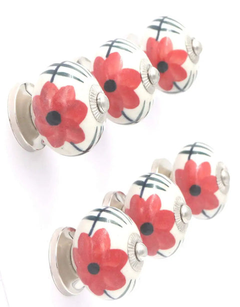 Hand Painted Ceramic Cabinet Knobs Set Of Six Features Dope Red Flower Motif For Dressers And Drawers, top view showing floral design.