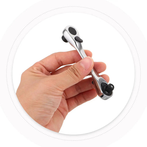 Rock Solid Mini Ratchet Wrench With 1/4 Inch Double Ended Reversible Socket and Knurled Finger Grip held in hand.