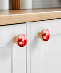 Solid 2 Piece Round Cabinet Knobs Crafted From Fine Beech Wood With Abstract Oil Painting Finish on kitchen cupboard.