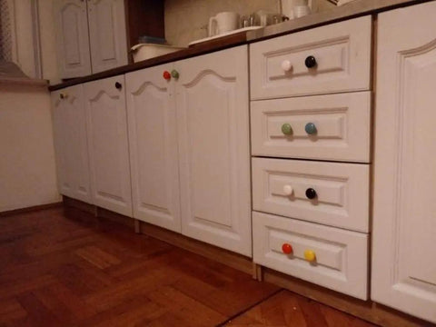 Kick Your Cabinet Game with These Slick Blue Ceramic Knobs, 32mm Round Drawer Pulls on white kitchen cabinets.