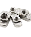 Close-up of M6 T Slot Nuts Forged From Nickel Plated Carbon Steel for 4545 Aluminum Extrusions, showcasing hammer head design.
