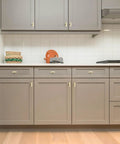 Top Shelf Brushed Gold Cabinet Handles Hella Sturdy Single Hole Drawer Pulls Two Inch Long Solid Zinc Hardware No Nonsense Thirty Pack For Slick Kitchen And Bath Renovations on gray kitchen cabinets.