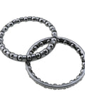 Stainless Steel Bicycle Headset Bearings Pack Includes Two Sets Of Twenty 5/32 Rollers in a close-up view, showcasing the shiny spheres.