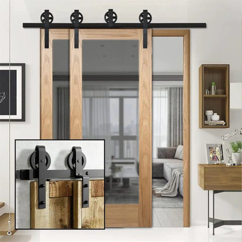 Heavy Duty 12 Ft Black Sliding Barn Door Hardware Kit For Double Doors Featuring Big Glide Rollers Rock Solid Steel Rail And No Sweat DIY Setup, showcasing the track and rollers on wooden doors.