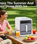 Compact Nugget Ice Maker With Self Cleaning Countertop Design producing chewable ice, displayed outdoors with drinks on picnic table.