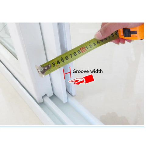 Measuring groove width with tape for Top Shelf Plastic Steel Door And Window Pulleys Sporting Double Grooved Wheels.