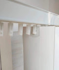 No Sweat Vertical Blinds Repair Kit featuring white plastic carrier brackets attached to standard louvers for easy installation.