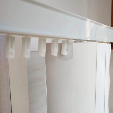 No Sweat Vertical Blinds Repair Kit featuring white plastic carrier brackets attached to standard louvers for easy installation.