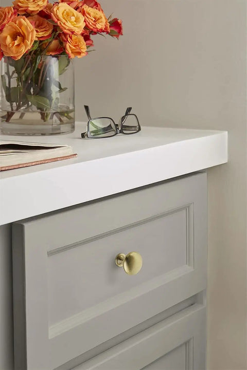 Ten Pack 1 1 4 Inch Round Cabinet Knobs Finished In Premium Golden Champagne Tone For Traditional Kitchen Drawers And Furniture heavy-duty build with dimpled grip on drawer.