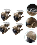 Vintage Brass Plate Swivel Caster Wheels Two Inch Diameter Heavy Duty Four Pack Rolling Casters for workbenches, close-up view.